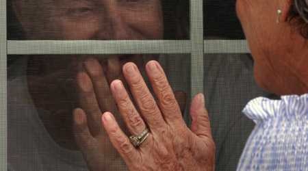 ANGELA CAPOCACCIA visits her husband Richard, after praying a rosary outside of the home where her husband Richard is being cared for. She said the rosary with a group of volunteer women on April 24, 2020, the Wings of Ave Maria Home. They prayed for the end of COVID-19. Family members are not allowed to see their loved ones at this time due to the virus and social distancing rules. Ave Maria is a Catholic long-term care community. The home currently has no cases of the Coronavirus. Ave Maria Home offers different levels of care for the aging in Bartlett, Tennessee.