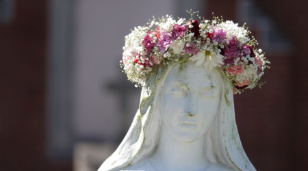 May 09, 2020- The Dominican Sisters of St. Cecilia participate in the May Crowning of Mary on Saturday outside St. Paul Church in Memphis, Tennessee. Usually the ceremony involve the chosen students, but this year, because of COVID 19 virus, they are doing a virtual variation of the ceremony. The sisters have administered the school since 1965. May Crowning is a traditional Roman Catholic ritual held during the month of May.  At the close of the procession a statue of the Blessed Virgin is crowned with a crown of flowers honoring Mary as Òthe Queen of May.Ó There is usually a special honor attached to being chosen to crown the statue © Karen Pulfer Focht