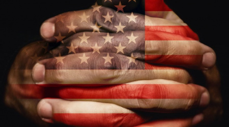 Crossed hands with USA flag