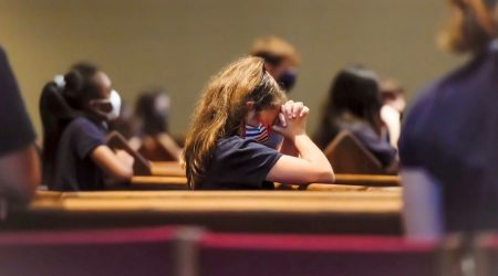 StMaryYoungStudentPraying